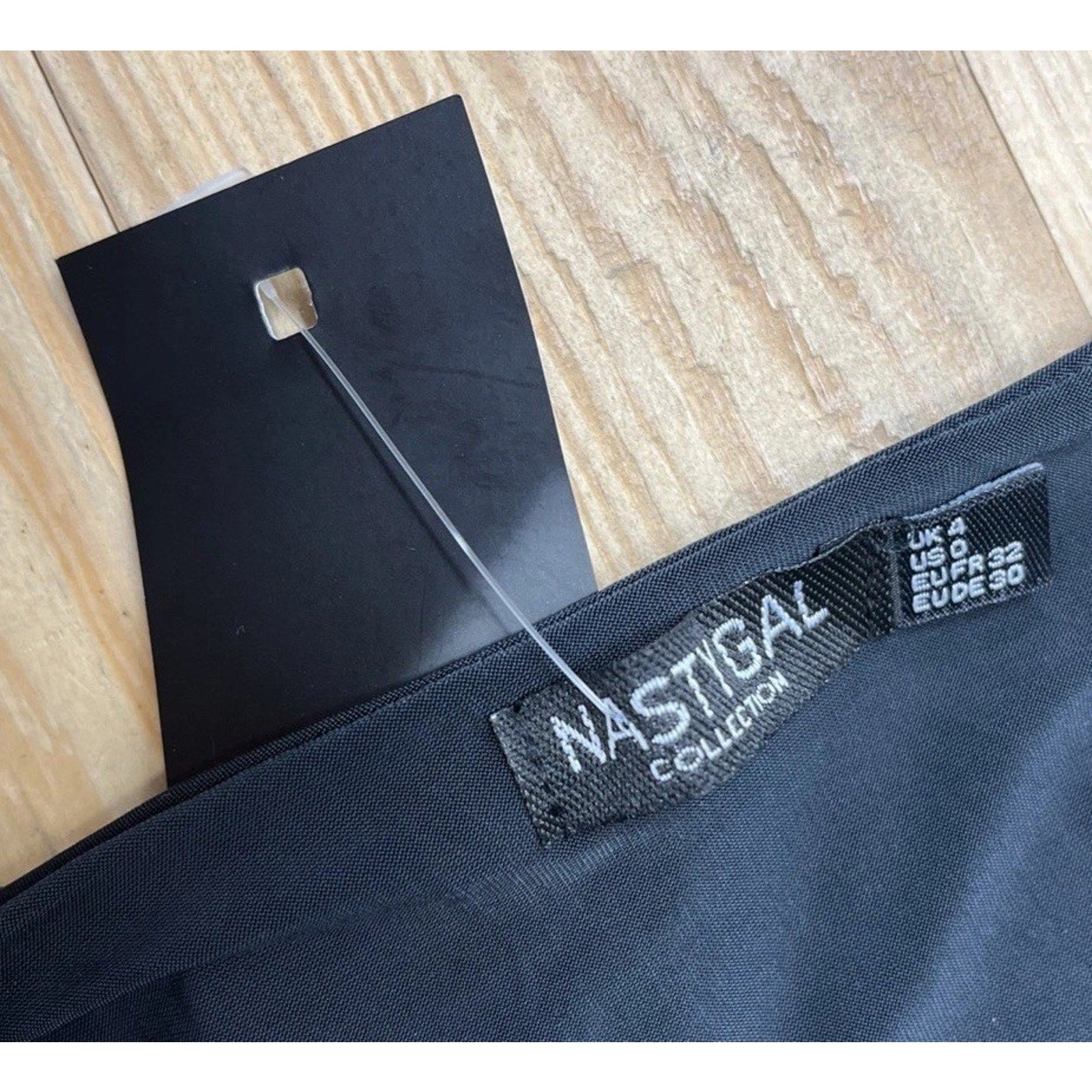 NWT Nasty Gal Shoulder Pad Slinky Plunge Bodysuit Black Size 0